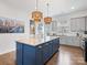 Well-appointed kitchen featuring an island, stainless steel appliances, stylish pendant lights, and ample counter space at 9710 Ainslie Downs St, Charlotte, NC 28273