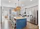 Spacious kitchen features an oversized island, pendant lighting, stainless steel appliances, and stylish cabinetry at 9710 Ainslie Downs St, Charlotte, NC 28273