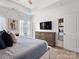 A serene main bedroom with a cozy bed, stylish dresser, and a large flat screen television for added comfort at 9710 Ainslie Downs St, Charlotte, NC 28273