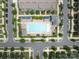 Overhead view of a community pool with lounge chairs, cabanas and manicured green spaces for residents at 9710 Ainslie Downs St, Charlotte, NC 28273