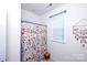 Bathroom featuring floral shower curtain and window at 9878 Verdun Ct, Fort Mill, SC 29707