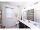 Bathroom with double vanity and floral shower curtain and tiled floors at 9878 Verdun Ct, Fort Mill, SC 29707