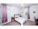 Cozy bedroom with carpeted floors, a chandelier, and a comfortable bed with a decorative headboard at 9878 Verdun Ct, Fort Mill, SC 29707