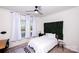 Cozy bedroom with ample natural light, ceiling fan, and neutral decor at 9878 Verdun Ct, Fort Mill, SC 29707
