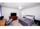 This cozy bedroom offers neutral walls, ceiling fan, plush carpet, and comfortable furnishings at 9878 Verdun Ct, Fort Mill, SC 29707