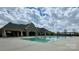 Community pool with bathhouse and stone clubhouse, all ready for neighborhood residents to enjoy at 9878 Verdun Ct, Fort Mill, SC 29707