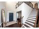 Grand entryway with high ceilings, hardwood floors, staircase, and a view into the adjacent office space at 9878 Verdun Ct, Fort Mill, SC 29707