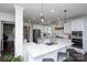 Elegant kitchen with white cabinetry, stainless steel appliances, and a large island at 9878 Verdun Ct, Fort Mill, SC 29707