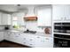 Well-appointed kitchen featuring white cabinetry, gas range, and stainless steel appliances at 9878 Verdun Ct, Fort Mill, SC 29707