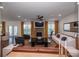 Spacious living room with stone fireplace, large windows, and stylish furnishings at 9878 Verdun Ct, Fort Mill, SC 29707