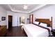 The primary bedroom has hardwood floors, tray ceiling, ensuite bath, and plenty of natural light at 9878 Verdun Ct, Fort Mill, SC 29707