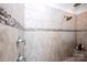 The tiled walk-in shower has tiled walls, showerhead, and a convenient corner shelf at 9878 Verdun Ct, Fort Mill, SC 29707
