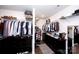Well-organized walk-in closet featuring dark wood cabinetry and ample hanging space at 9878 Verdun Ct, Fort Mill, SC 29707