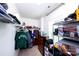 Organize your wardrobe in this spacious walk-in closet with shelving, drawers, and plush carpet at 9878 Verdun Ct, Fort Mill, SC 29707