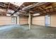 Unfinished basement featuring exposed ceiling, green carpet, and a support beam at 109 Windmill Rd, Salisbury, NC 28147