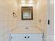 Small bathroom with a vanity, mirror, and patterned wallpaper at 109 Windmill Rd, Salisbury, NC 28147