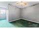 Light grey bedroom featuring a closet and window at 109 Windmill Rd, Salisbury, NC 28147