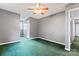 Bedroom featuring gray walls, green carpet and a ceiling fan for a comfortable living space at 109 Windmill Rd, Salisbury, NC 28147