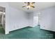 A blue bedroom featuring attached sitting room and window at 109 Windmill Rd, Salisbury, NC 28147