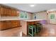 Charming kitchen featuring wooden cabinets and a central island with seating at 109 Windmill Rd, Salisbury, NC 28147