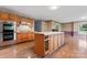 Charming kitchen featuring wooden cabinets and a central island with ample counter space at 109 Windmill Rd, Salisbury, NC 28147