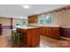 Bright kitchen featuring wood cabinets and a central island adjacent to the breakfast area at 109 Windmill Rd, Salisbury, NC 28147