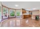 Sunlit room offering wood floors and expansive windows providing scenic outdoor views at 109 Windmill Rd, Salisbury, NC 28147