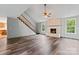 Living room with hardwood floors and brick fireplace at 109 Windmill Rd, Salisbury, NC 28147