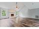 Spacious living area with hardwood floors, fireplace, and vaulted ceiling at 109 Windmill Rd, Salisbury, NC 28147