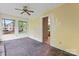 Bright living room with a ceiling fan and large windows at 109 Windmill Rd, Salisbury, NC 28147