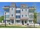 Beautiful townhome exterior showcasing modern architecture, multi-story windows, and rooftop decks at 1105 Reece Rd, Charlotte, NC 28209
