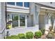 Charming front porch with a swing, brick accents, and manicured landscaping at 1105 Reece Rd, Charlotte, NC 28209