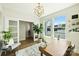 Bright home office with hardwood floors, stylish lighting, and large windows offering plenty of natural light at 1105 Reece Rd, Charlotte, NC 28209