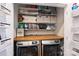 Well-organized laundry room with front-load washer and dryer, and ample shelving at 1105 Reece Rd, Charlotte, NC 28209
