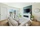 Comfortable living room with a large window, a modern fireplace, and stylish decor at 1105 Reece Rd, Charlotte, NC 28209