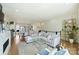 Open-concept living room and dining area with hardwood floors, modern fireplace and décor at 1105 Reece Rd, Charlotte, NC 28209