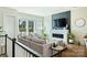 Cozy living room featuring a fireplace, wall-mounted TV, and comfortable sofa at 1105 Reece Rd, Charlotte, NC 28209