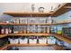Well-organized walk-in pantry with wooden shelves stocked with various food items and storage containers at 1105 Reece Rd, Charlotte, NC 28209