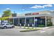 Exterior shot of Burton's Grill & Bar, showcasing its outdoor seating and signage at 1105 Reece Rd, Charlotte, NC 28209