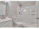 Clean bathroom featuring a vanity with chrome faucet and shower at 111 Quinn Ave, Gastonia, NC 28054
