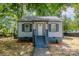 Charming single-story home with gray siding, gray trim, and a covered front porch entry at 111 Quinn Ave, Gastonia, NC 28054