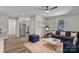 Inviting living room featuring a comfortable blue sofa, stylish ottoman, and neutral decor at 111 Quinn Ave, Gastonia, NC 28054