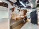Basement with utility area featuring workbench and access to the home's mechanical systems at 1113 Gregory Ln, Statesville, NC 28677