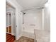Bathroom with tub and shower features updated hardware and a showerhead at 1113 Gregory Ln, Statesville, NC 28677