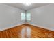 Cozy bedroom featuring hardwood floors and double windows at 1113 Gregory Ln, Statesville, NC 28677