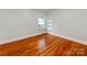 Bedroom with a built in bookshelf and wood floors at 1113 Gregory Ln, Statesville, NC 28677