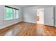 Bedroom featuring hardwood floors and views of the lush outdoors at 1113 Gregory Ln, Statesville, NC 28677