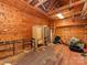 Spacious unfinished garage with wooden walls and ceiling offers potential for customization and storage at 1113 Gregory Ln, Statesville, NC 28677