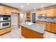 Spacious kitchen with an island sink and stainless steel hood at 1113 Gregory Ln, Statesville, NC 28677