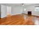 Bright living room featuring a fireplace, hardwood floors, and plenty of natural light at 1113 Gregory Ln, Statesville, NC 28677